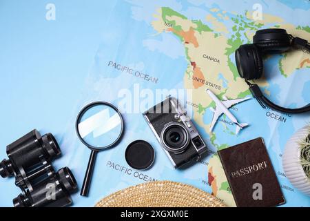 Flat lay composition with travel blogger`s items on light blue background Stock Photo